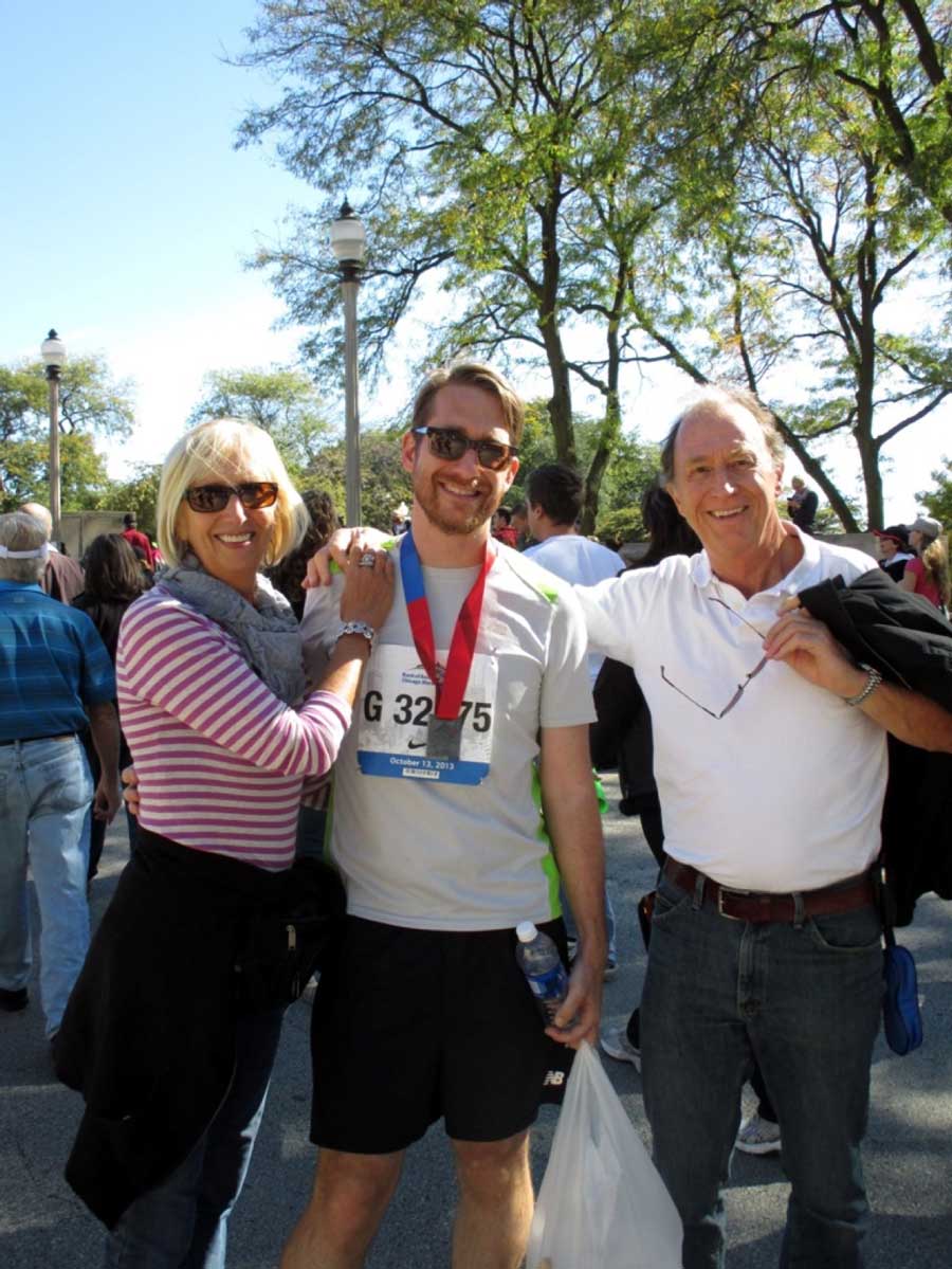 Tom at the finish line with parents